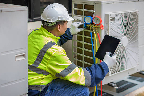 Professional Air Conditioning Repair technician working in Whitehall, MI